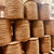 Stacked Spools of Brown Fiber Paper Rush Forty Pound Reels stacked up in HH Perkins warehouse.